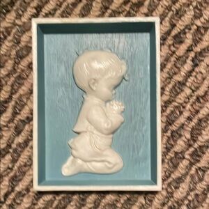 Vintage praying boy wall art.